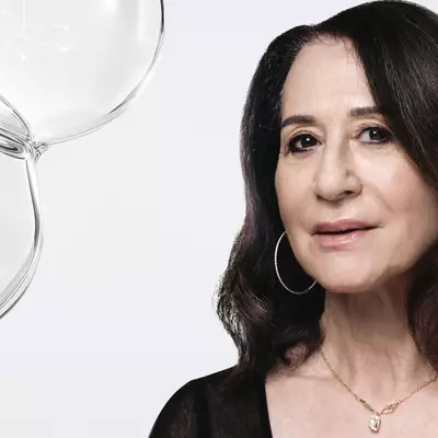 Dermatologist Dr. Anny Cohen-Letessier alongside scientific cellular network bubbles by Helena Rubinstein.