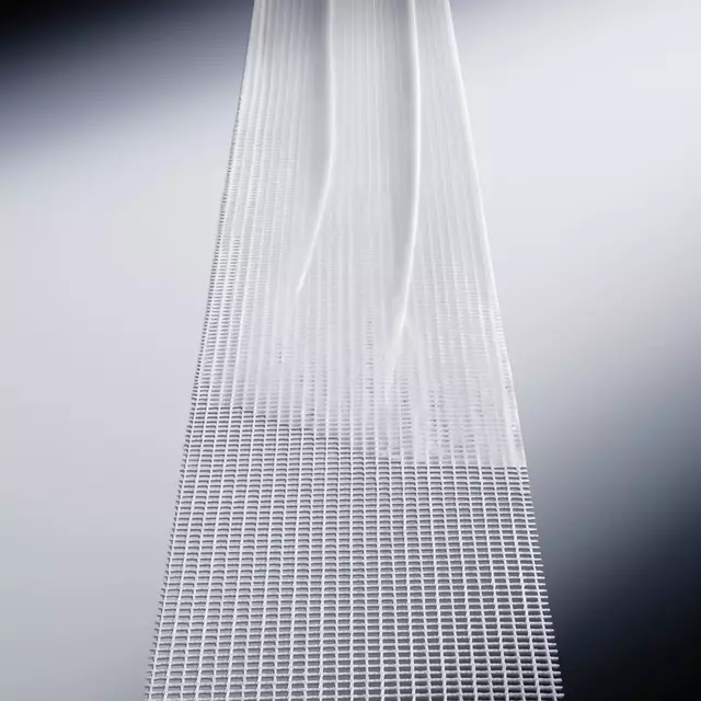 Smooth white cream texture gliding over a structured mesh band for advanced skin recovery.