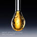 Golden serum droplet with Pro-Xylane™ ingredient, showing its rich, bubbly texture and luxurious essence.